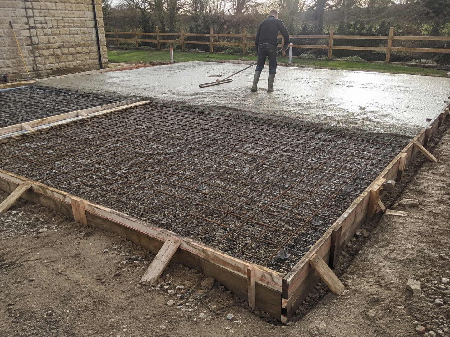 Site preparation and grading for a new concrete driveway